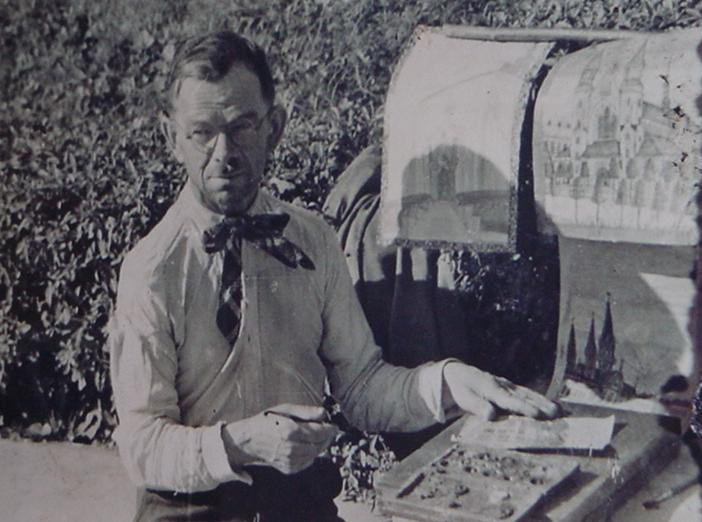 Photo of Nikifor with paintings displayed